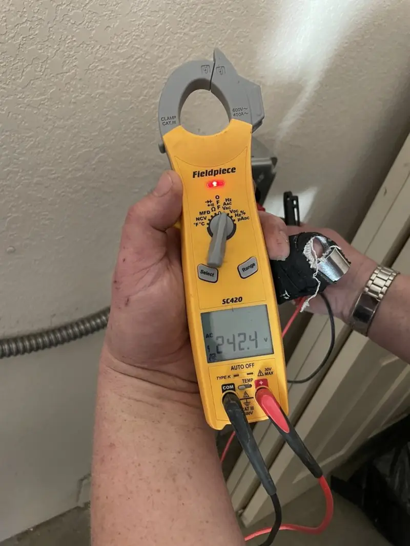 Voltage testing with clamp meter during Generator Installation in White City